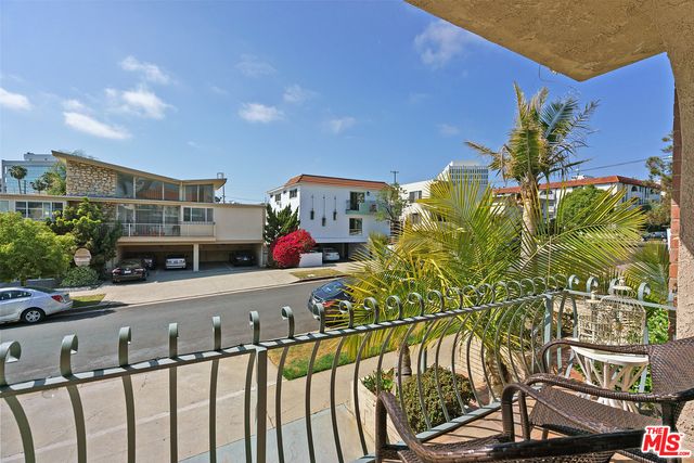 a view of swimming pool with seating space