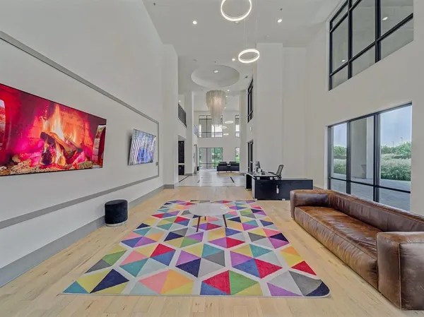 a bedroom with furniture and a flat screen tv