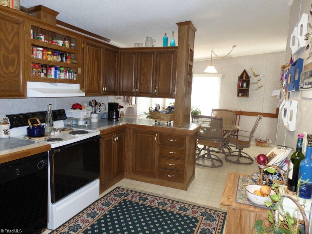 1744 Finch Farm Road Thomasville, NC 27360 - Photo 12 of 25 Kitchen and sunroom/breakfast nook