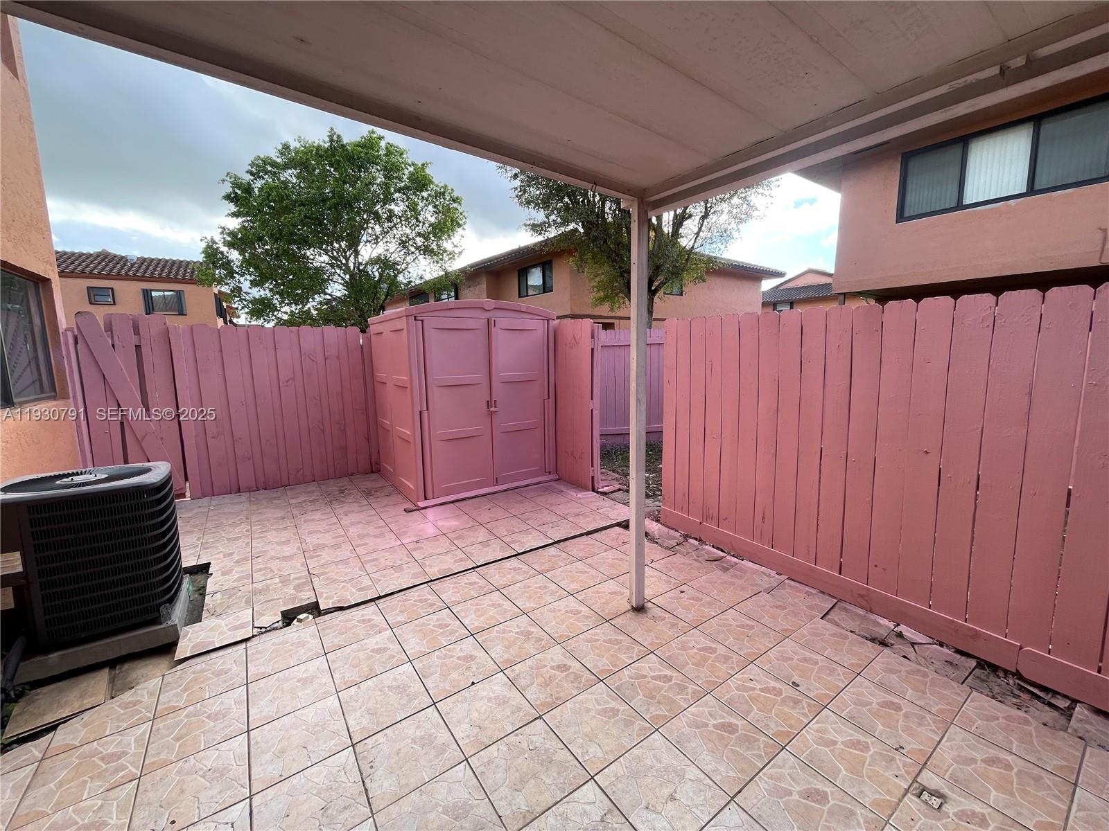 6450 West 27th Way, Unit 101 Hialeah, FL 33016 - Photo 10 of 11 a view of a backyard