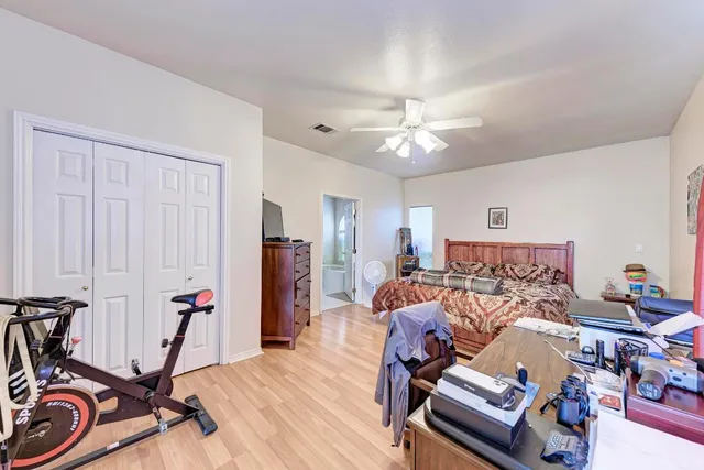 a view of a livingroom with furniture and gym equipment
