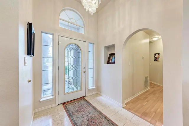 a view of an entryway with a chandelier