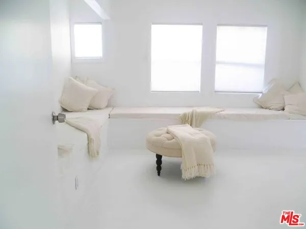 a bathroom with a bathtub and a table