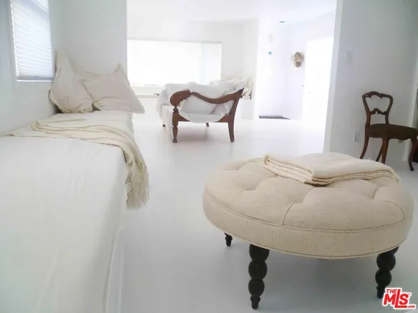 a room with a bed and a chair