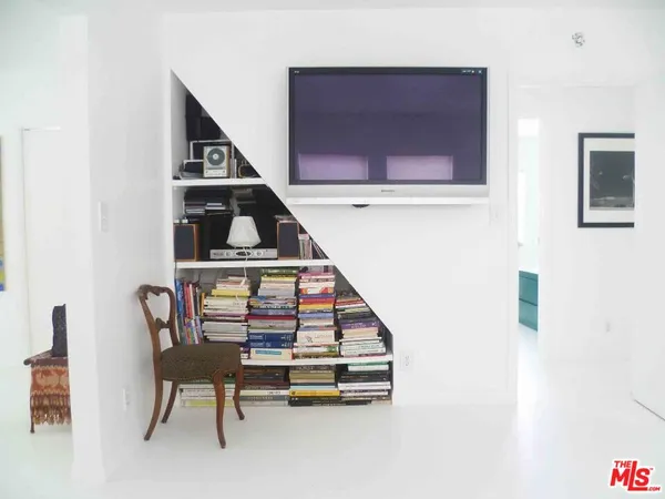 a view of a livingroom with furniture and staircase