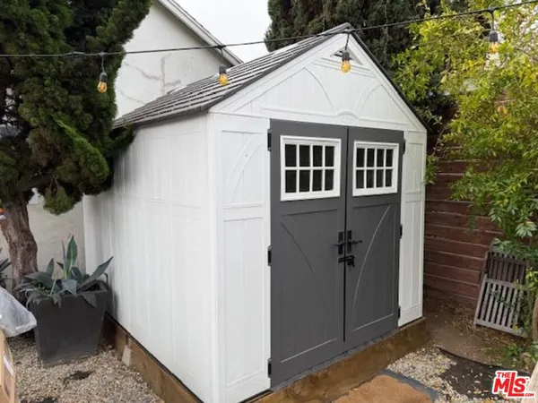 a view of a garage with parked cars
