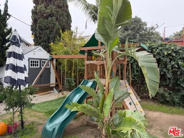 a view of a backyard with sitting area