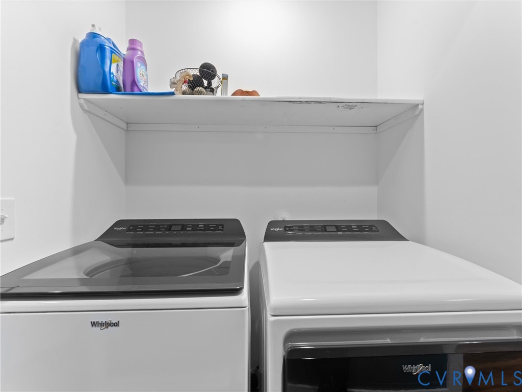 408 Howerton Road Tappahannock, VA 22560 - Photo 35 of 49 Built-in overhead shelving unit, white walls, and