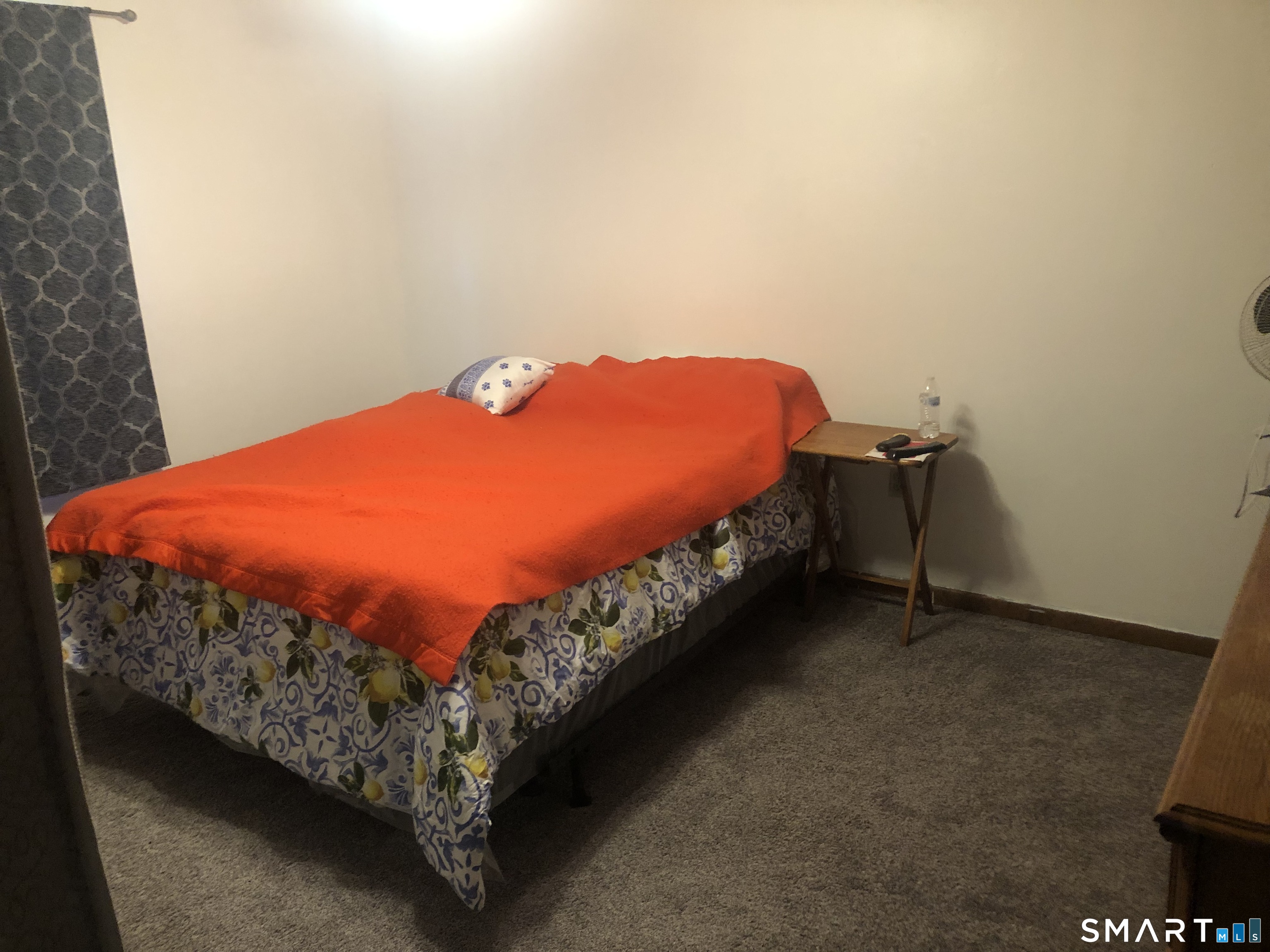 862 Pleasant Valley Road South Windsor, CT 06074 - Photo 12 of 13 a bed sitting in a bedroom next to a wall