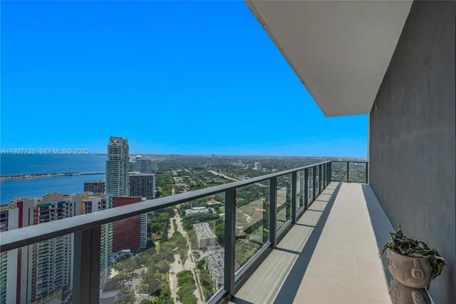 an empty room with sliding door and mountain view