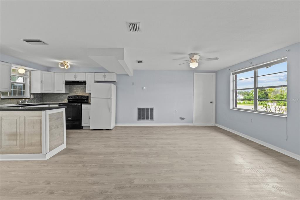 1623 Plum Tree Road Holiday, FL 34690 - Photo 5 of 33 a view of a kitchen with microwave and cabinets