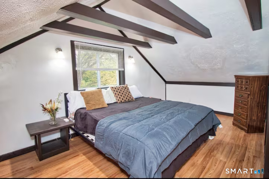 15 Lower Road North Canaan, CT 06018 - Photo 33 of 36 a bed sitting in a bedroom next to a window