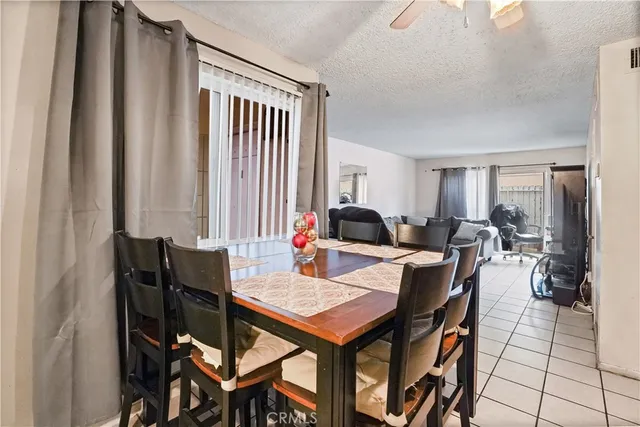 a kitchen with stainless steel appliances granite countertop a sink and a refrigerator