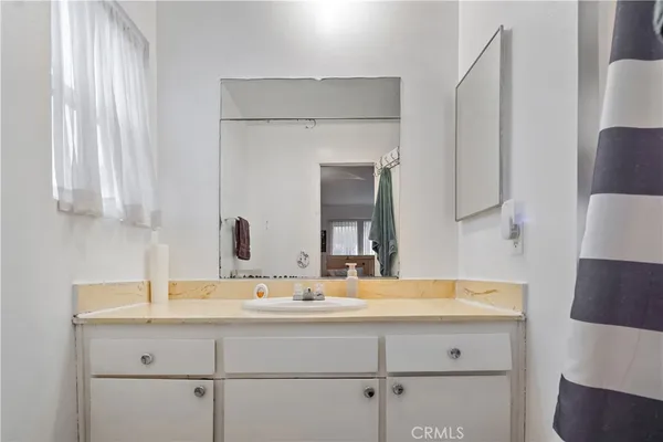 a bathroom with a sink and a mirror