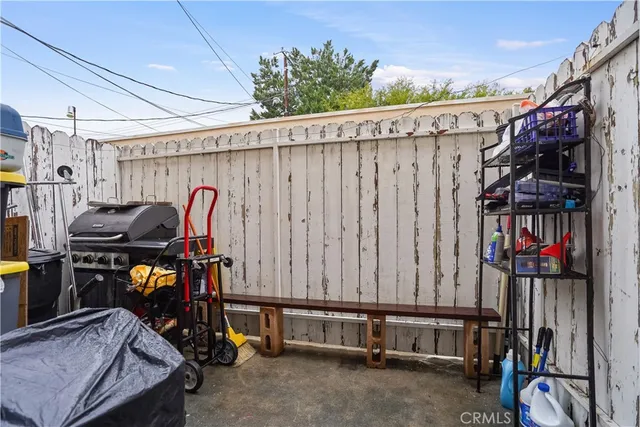 a view of staircase with railing and white walls