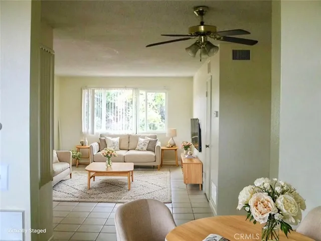 a bedroom with bed and large window