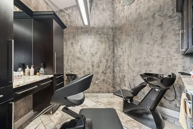 a kitchen with a sink and a stove top oven