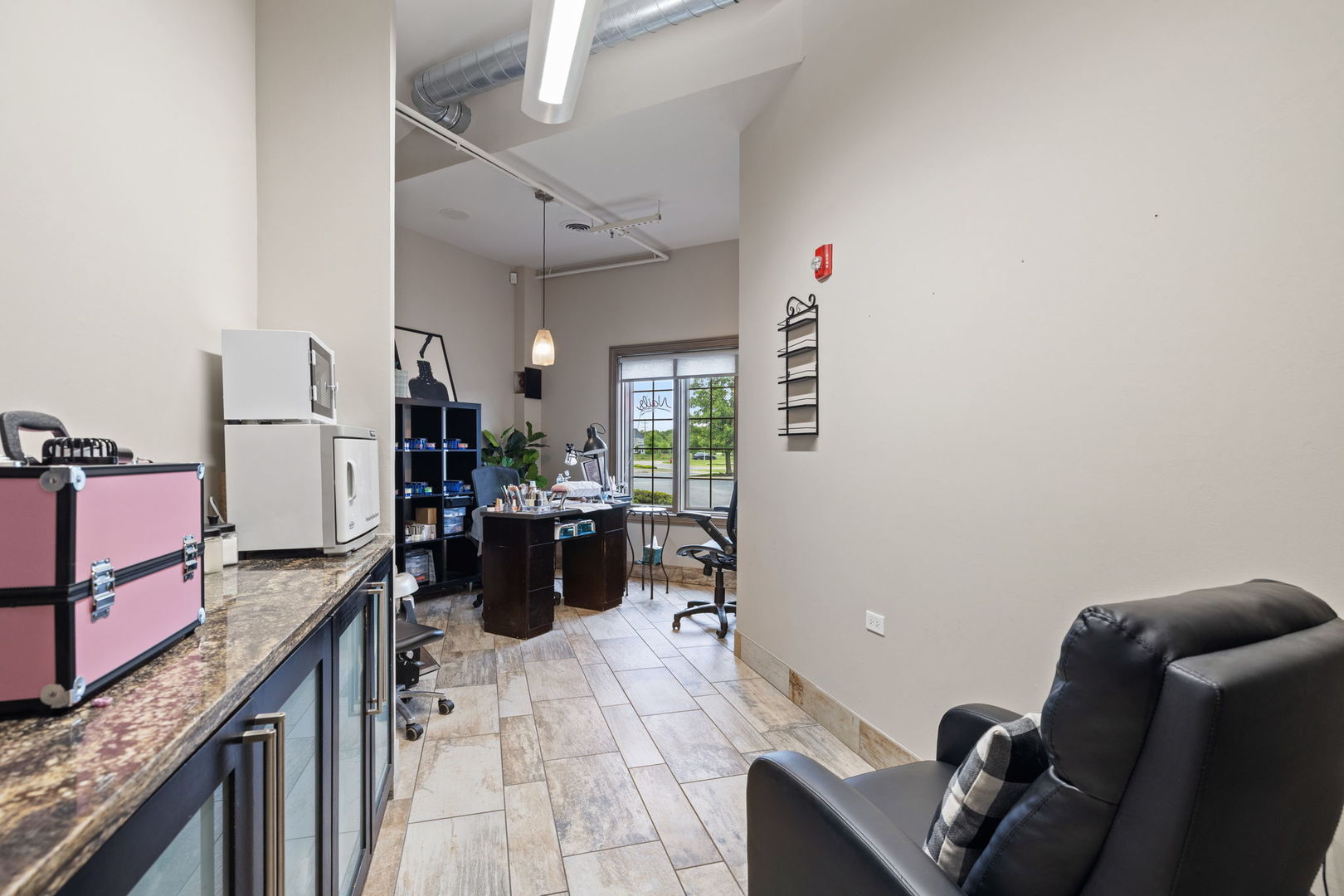 3941 75th Street, Unit 3941 Aurora, IL 60504 - Photo 12 of 25 a kitchen with a refrigerator and furniture
