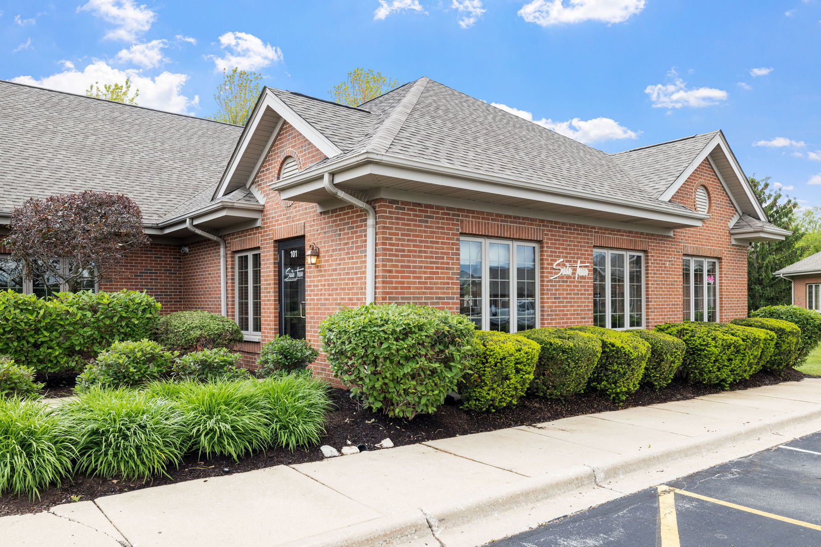 3941 75th Street, Unit 3941 Aurora, IL 60504 - Photo 19 of 25 front view of a house with a garden