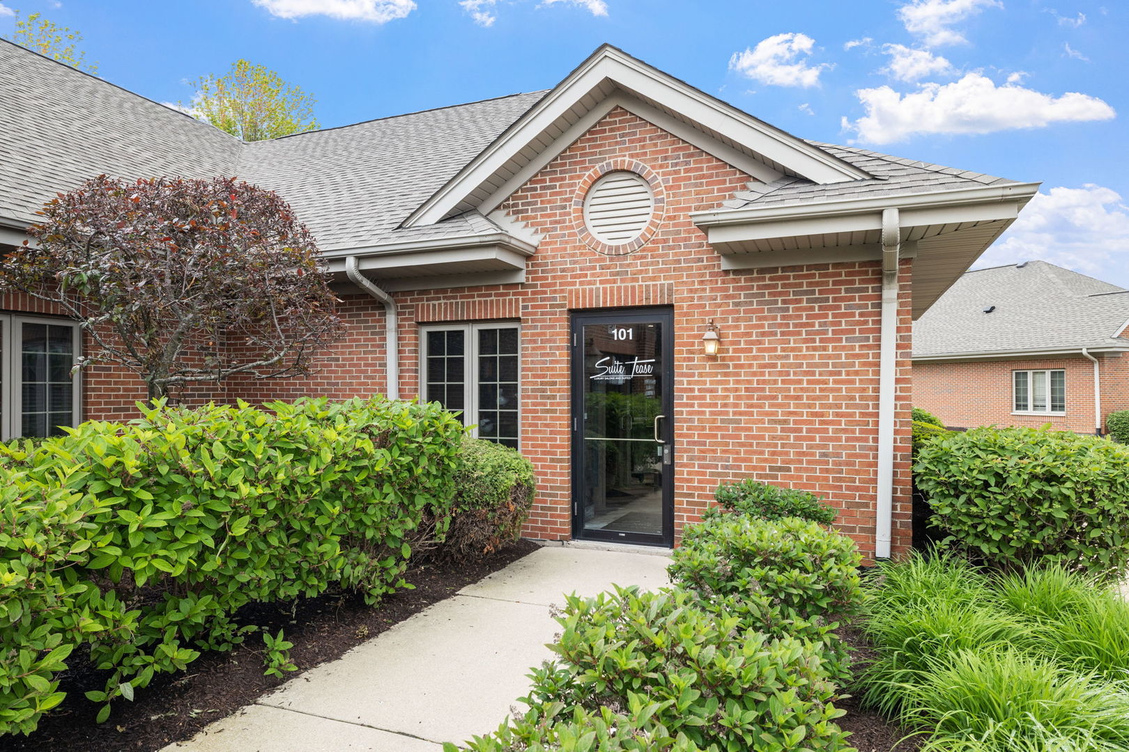 3941 75th Street, Unit 3941 Aurora, IL 60504 - Photo 3 of 25 a front view of a house with garden