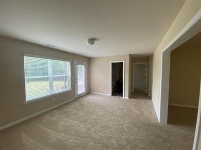 3829 Baxley Ridge Drive Suwanee, GA 30024 - Photo 7 of 11 an empty room with windows and closet