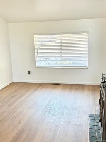 a view of kitchen and empty room