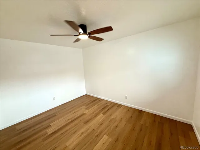 a view of a small space with wooden floor