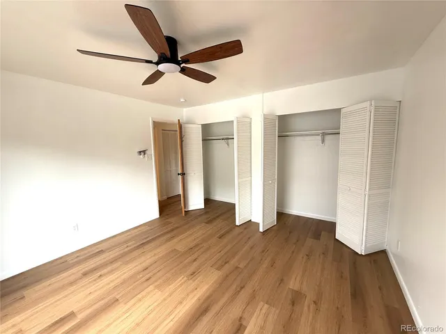 a view of an empty room and wooden floor