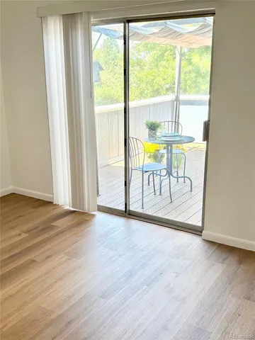 a view of outdoor space with wooden floor