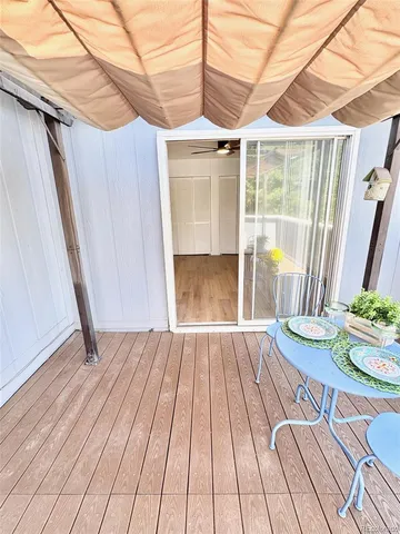 a view of a chairs and table in patio
