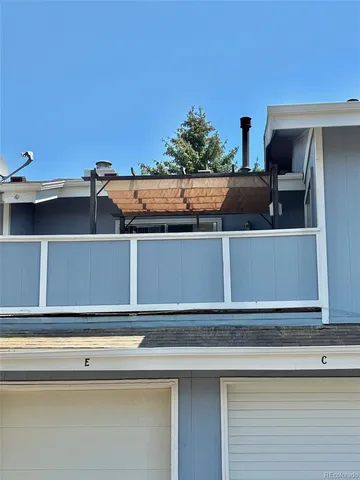 a view of a kitchen with wooden cabinet and a stove top oven