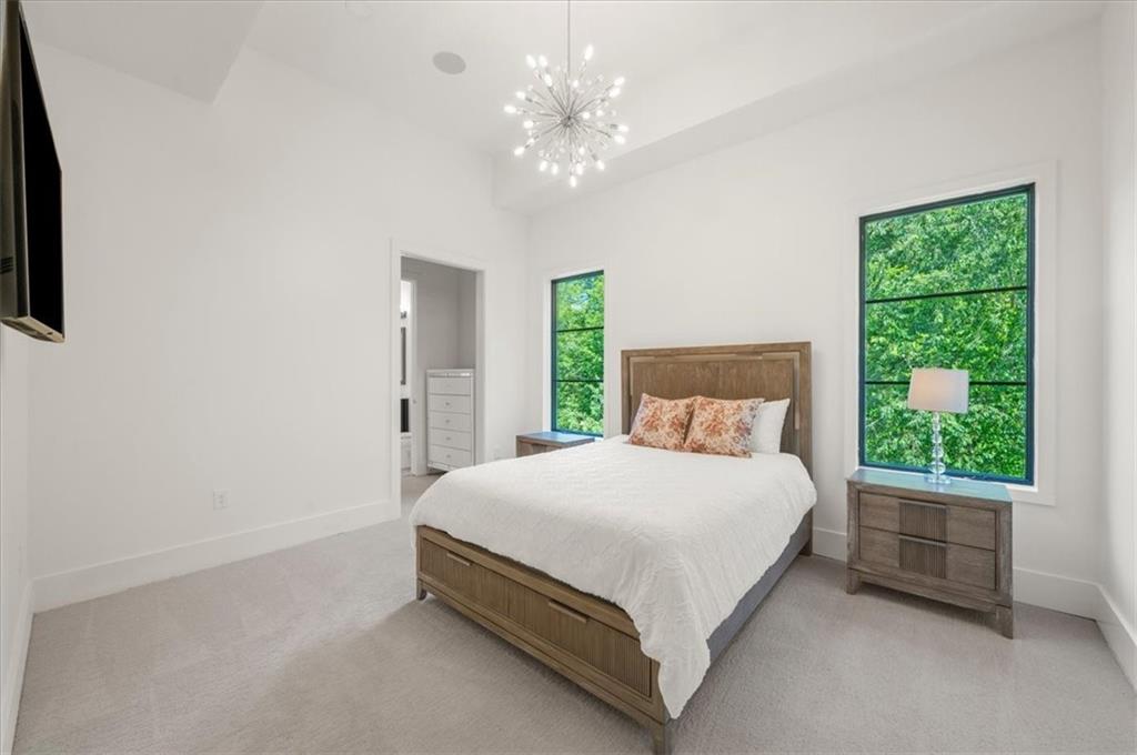 494 River Overlook Road Dawsonville, GA 30534 - Photo 30 of 96 a large bed sitting in a bedroom next to a window
