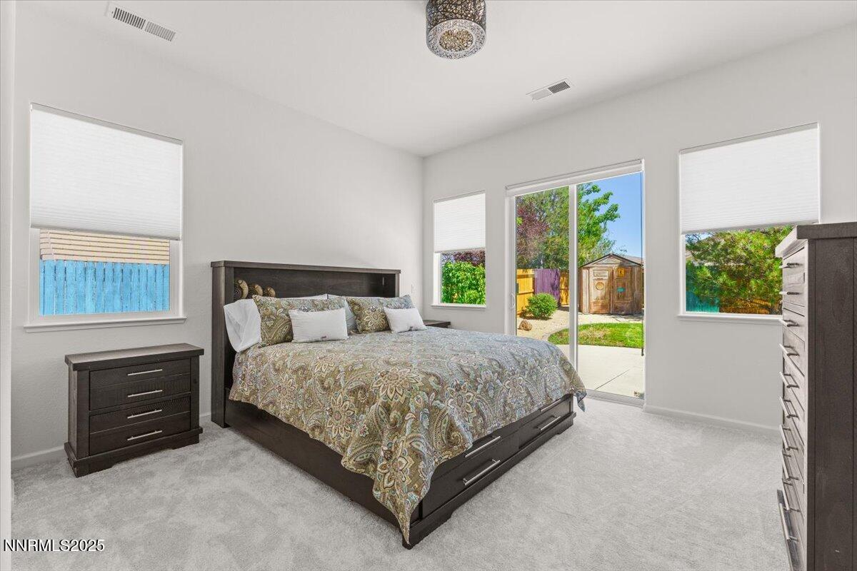 2515 Perryville Drive Reno, NV 89521 - Photo 9 of 19 a bed sitting in a bedroom next to a window