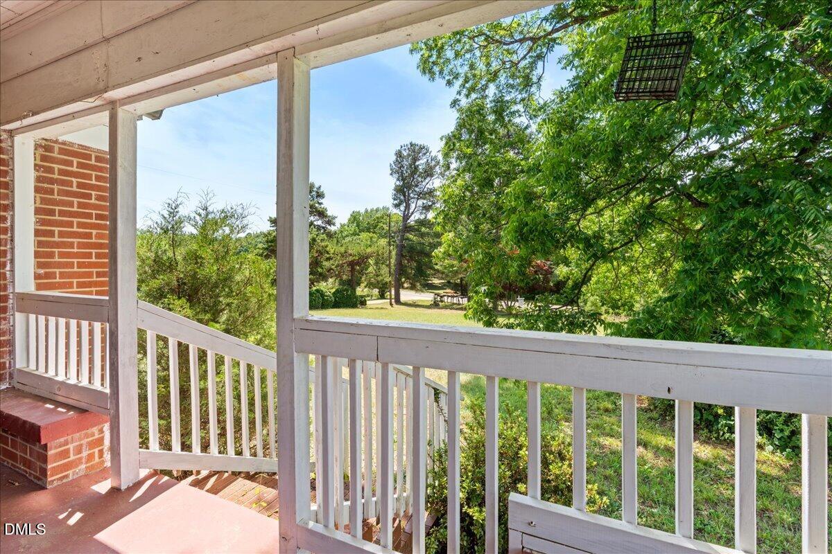 109 Little Ponderosa Road Macon, NC 27551 - Photo 2 of 32 a view of a balcony with lake view