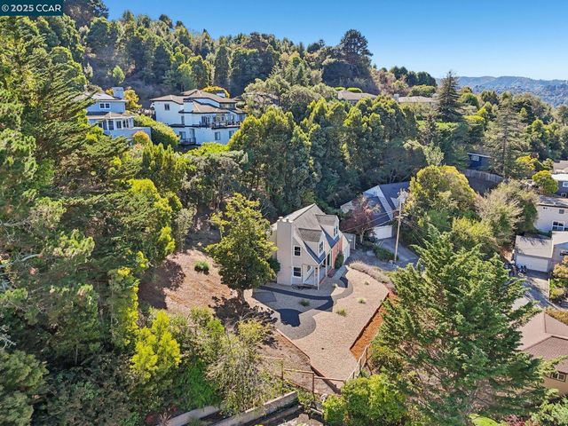 an aerial view of a house with outdoor space