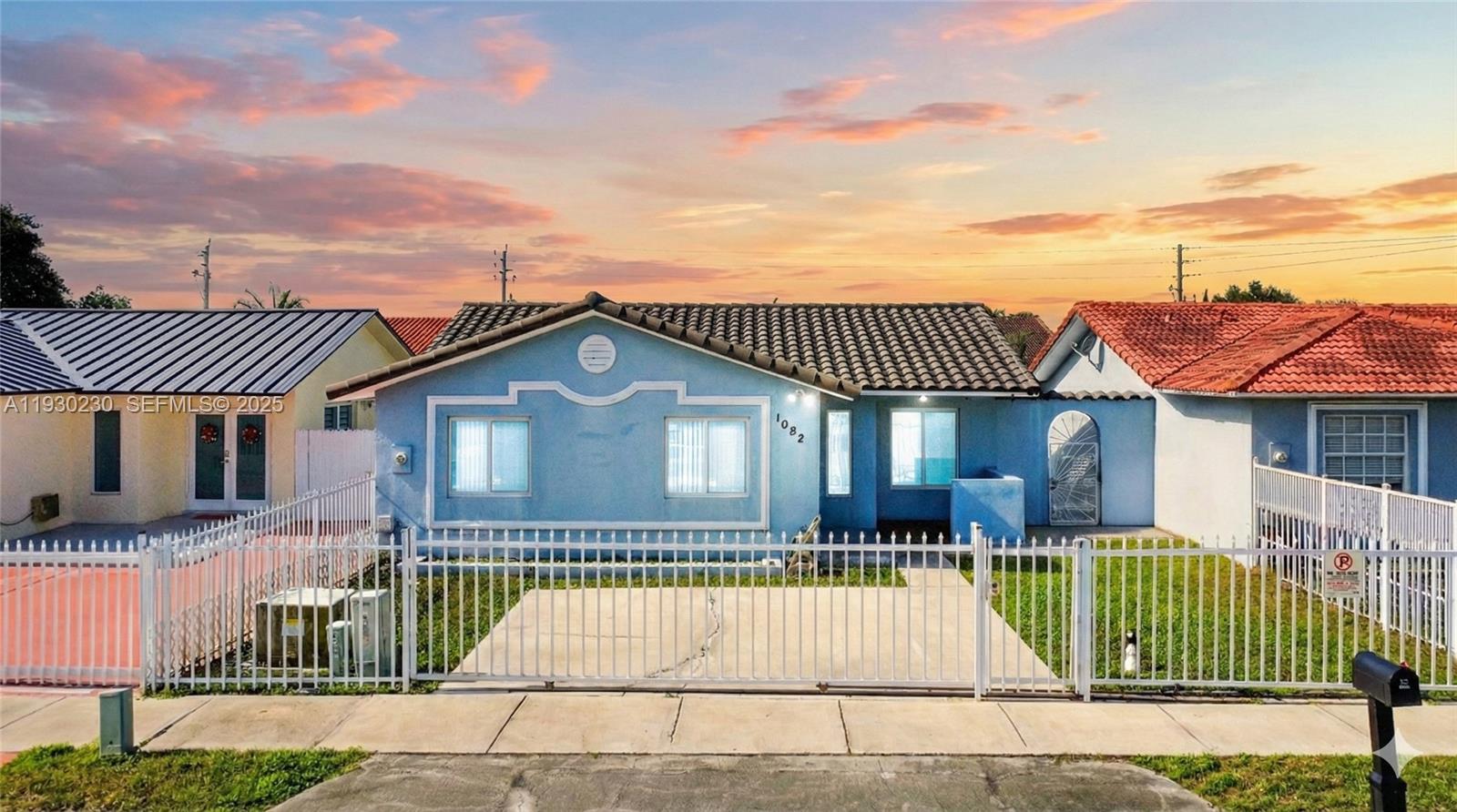 a view of a house with a iron gate