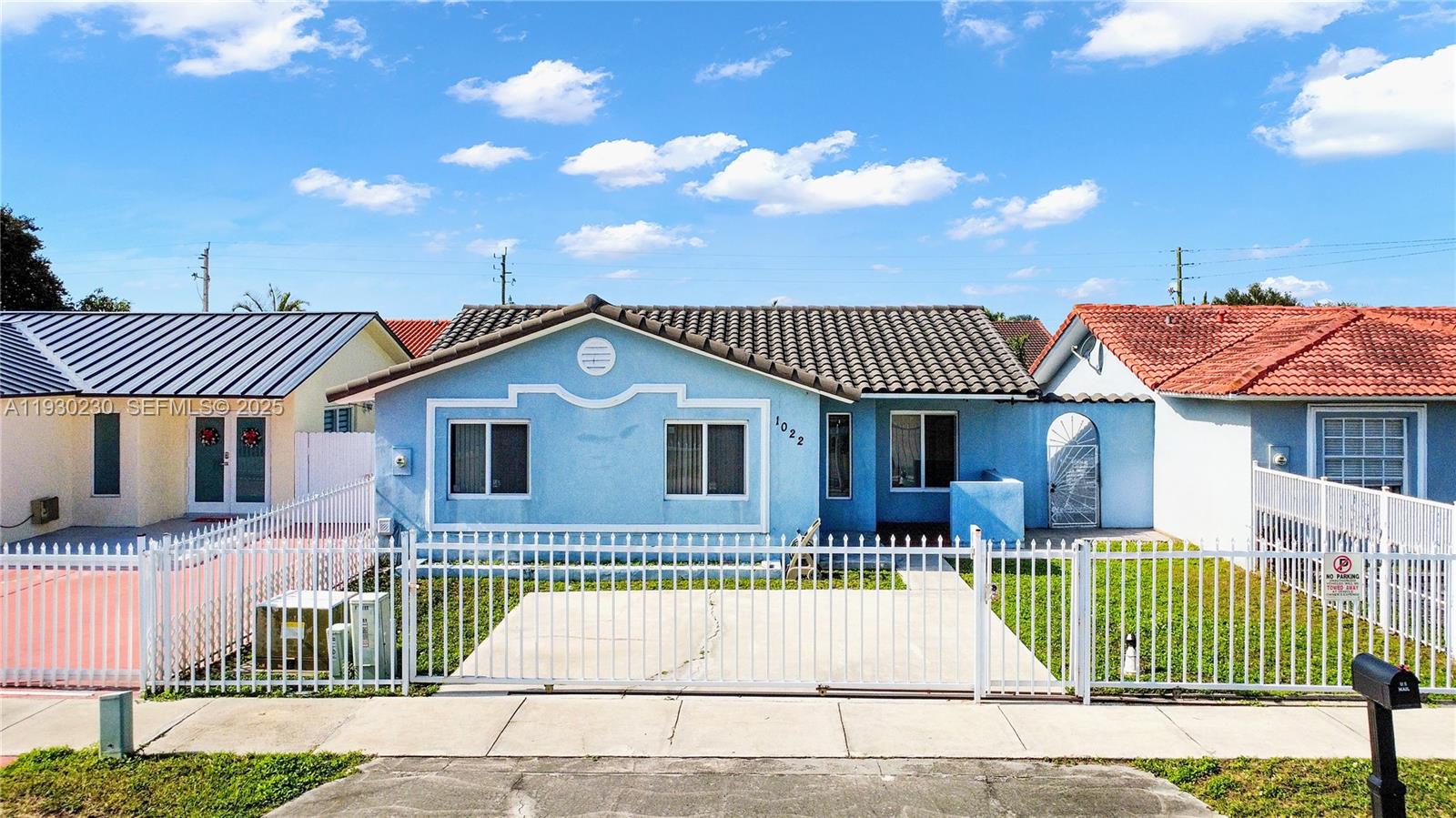 1022 Southwest 138th Place Miami, FL 33184 - Photo 3 of 39 a front view of a house with a patio