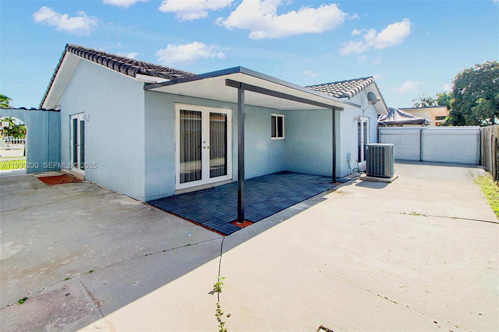 1022 Southwest 138th Place Miami, FL 33184 - Photo 32 of 39 a view of a house with a garage