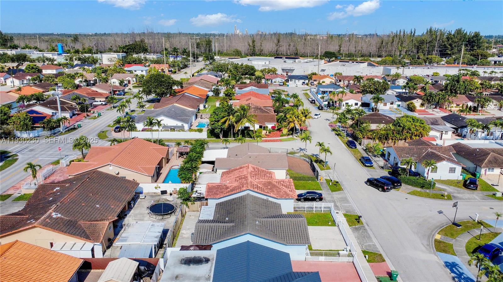 1022 Southwest 138th Place Miami, FL 33184 - Photo 38 of 39 an aerial view of residential houses with outdoor space and parking