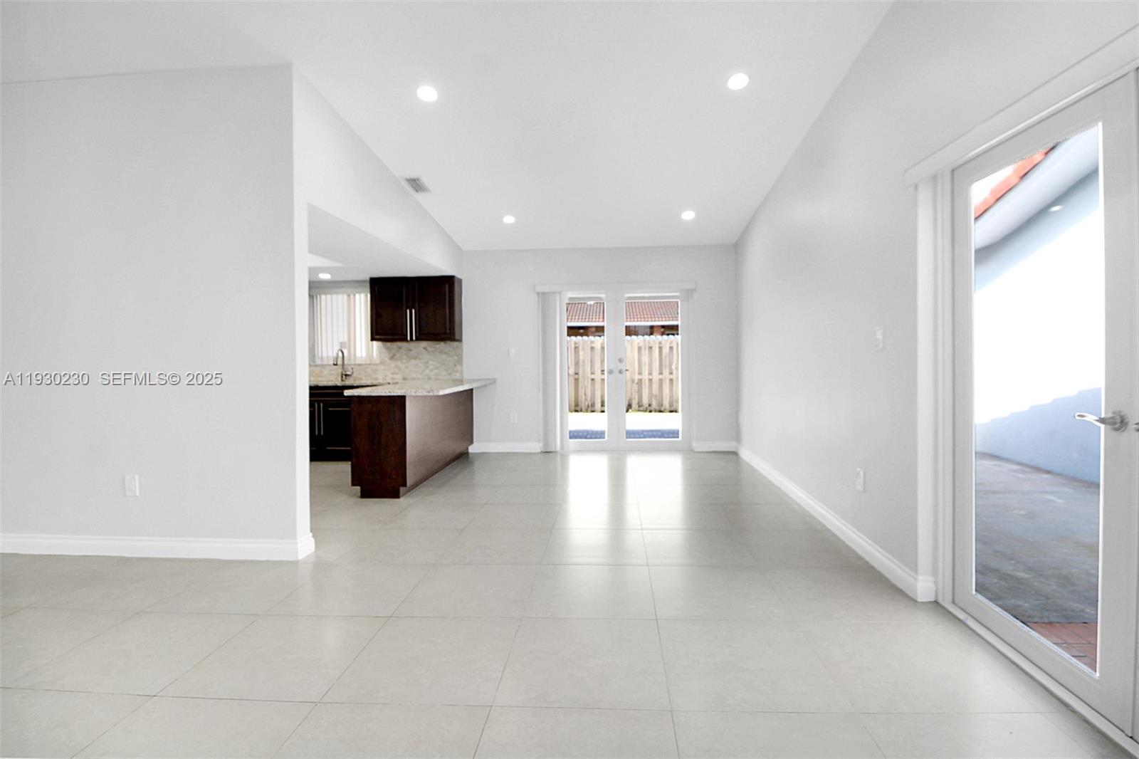 1022 Southwest 138th Place Miami, FL 33184 - Photo 10 of 39 a view of a kitchen with a sink and a fireplace