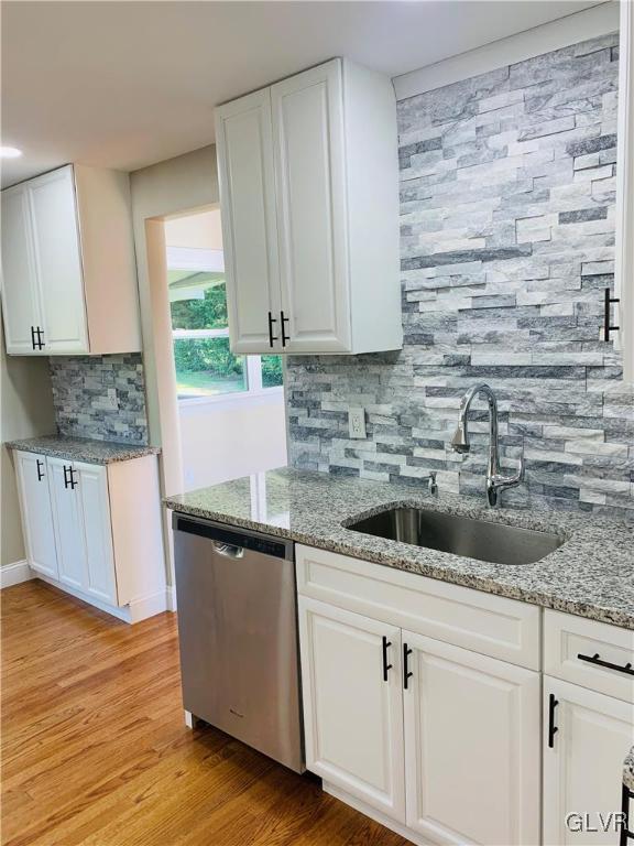 560 Knauss Road Nazareth, PA 18064 - Photo 11 of 25 a kitchen with stainless steel appliances granite countertop a sink a stove and a wooden cabinets