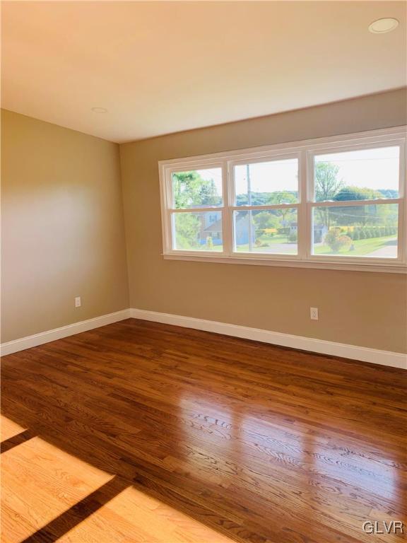 560 Knauss Road Nazareth, PA 18064 - Photo 13 of 25 a view of an empty room with wooden floor and a window