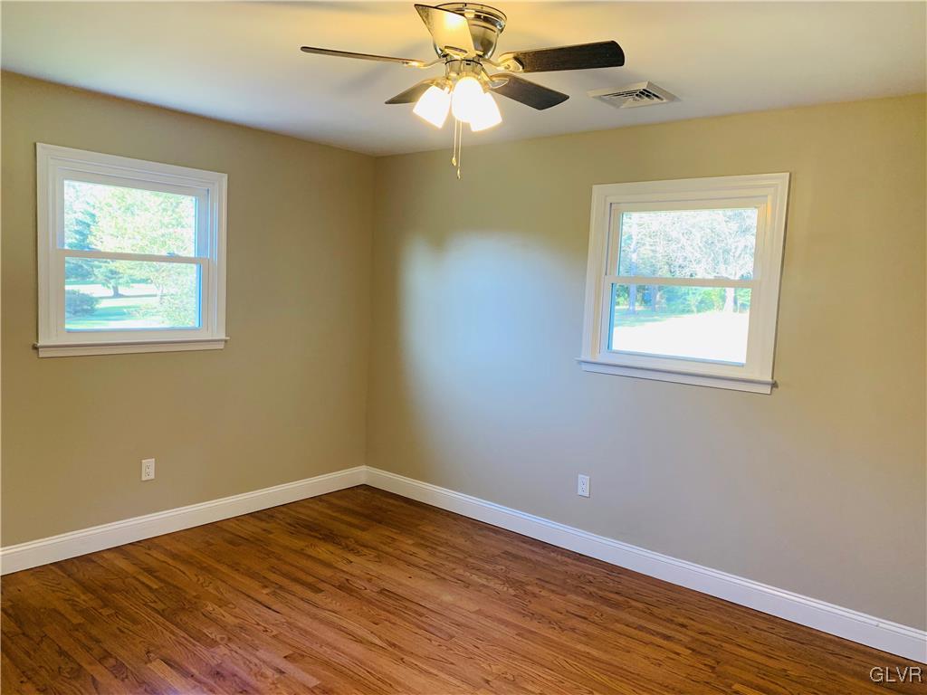 560 Knauss Road Nazareth, PA 18064 - Photo 14 of 25 a view of an empty room with wooden floor and a window