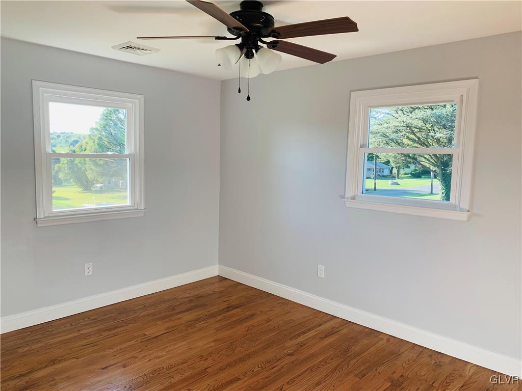 560 Knauss Road Nazareth, PA 18064 - Photo 16 of 25 a view of an empty room with wooden floor and a window