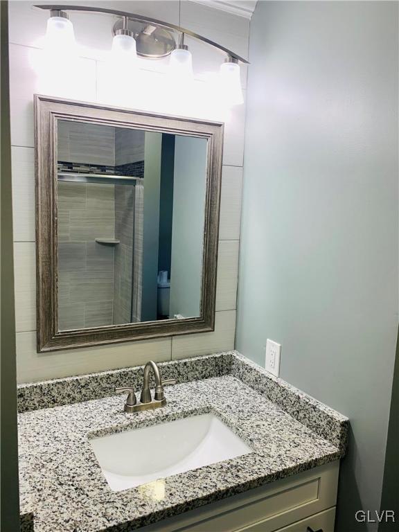 560 Knauss Road Nazareth, PA 18064 - Photo 17 of 25 a bathroom with a granite countertop sink and a mirror