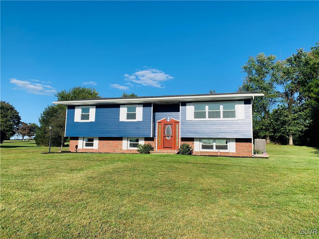 560 Knauss Road Nazareth, PA 18064 - Photo 2 of 25 a front view of a house with a garden and trees