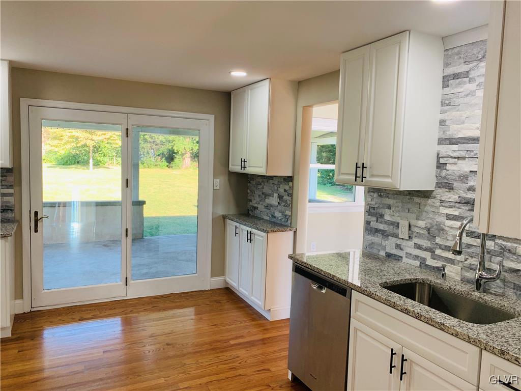 560 Knauss Road Nazareth, PA 18064 - Photo 10 of 25 a kitchen with a sink a refrigerator and cabinets