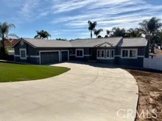 a front view of a house with yard