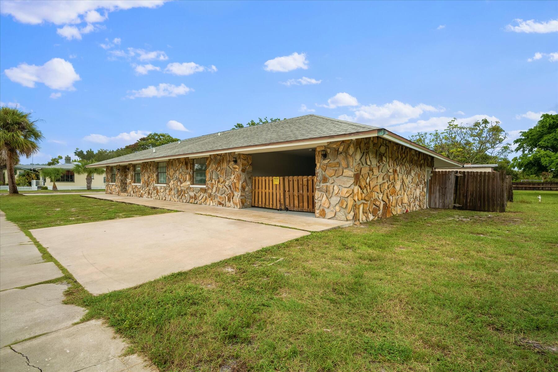 300 East Fee Avenue Melbourne, FL 32901 - Photo 26 of 27 a view of an house with backyard space and garden