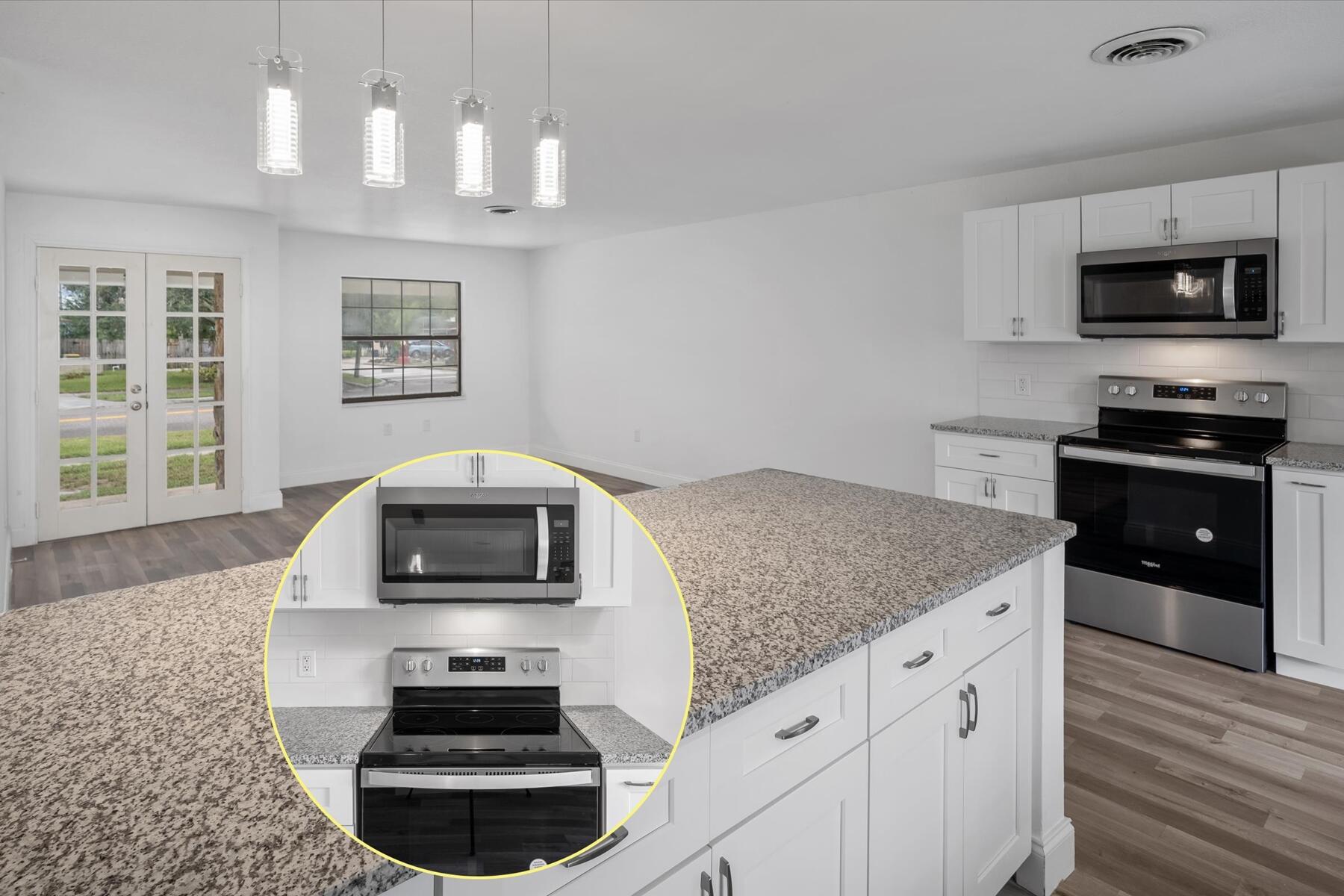 300 East Fee Avenue Melbourne, FL 32901 - Photo 6 of 27 a kitchen with stainless steel appliances granite countertop a stove and a microwave